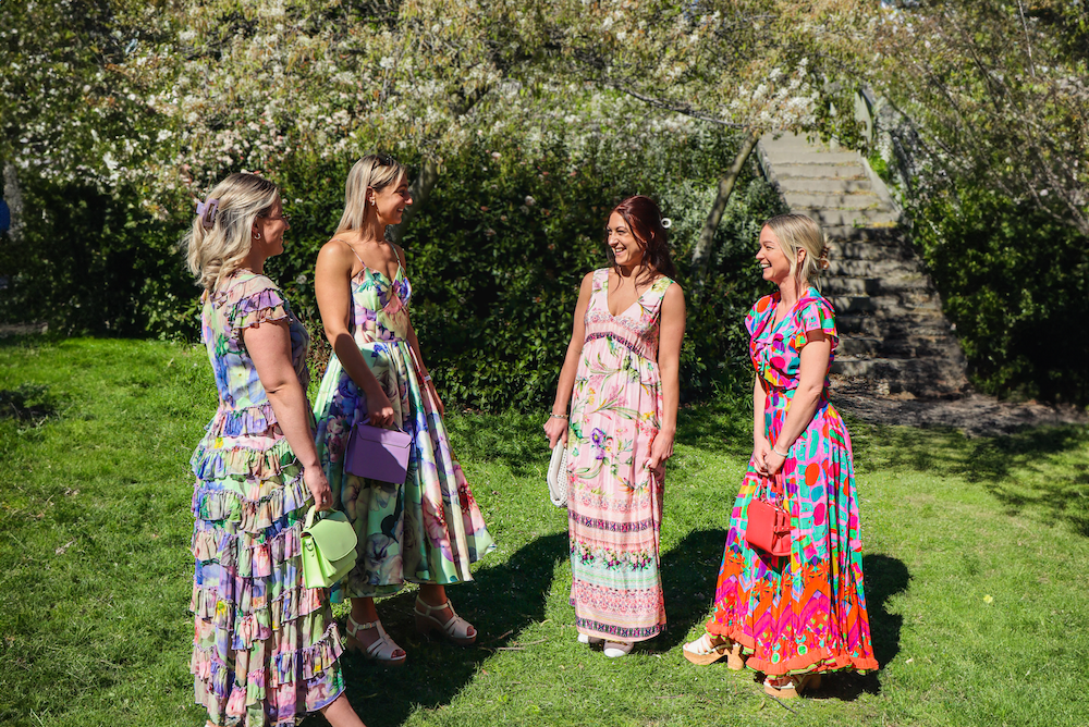 The Wallace and Gibbs Arrowtown staff wearing a collection of Trelise Cooper brand dresses and Saben, Top End & Kathryn Wilson accessories